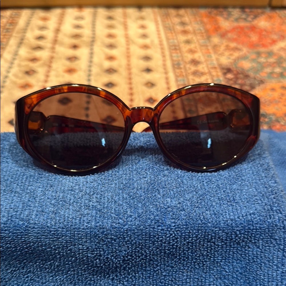 Daniel Swarovski Tortoise Shell Sunglasses with Amber Swarovski stone. Classy!